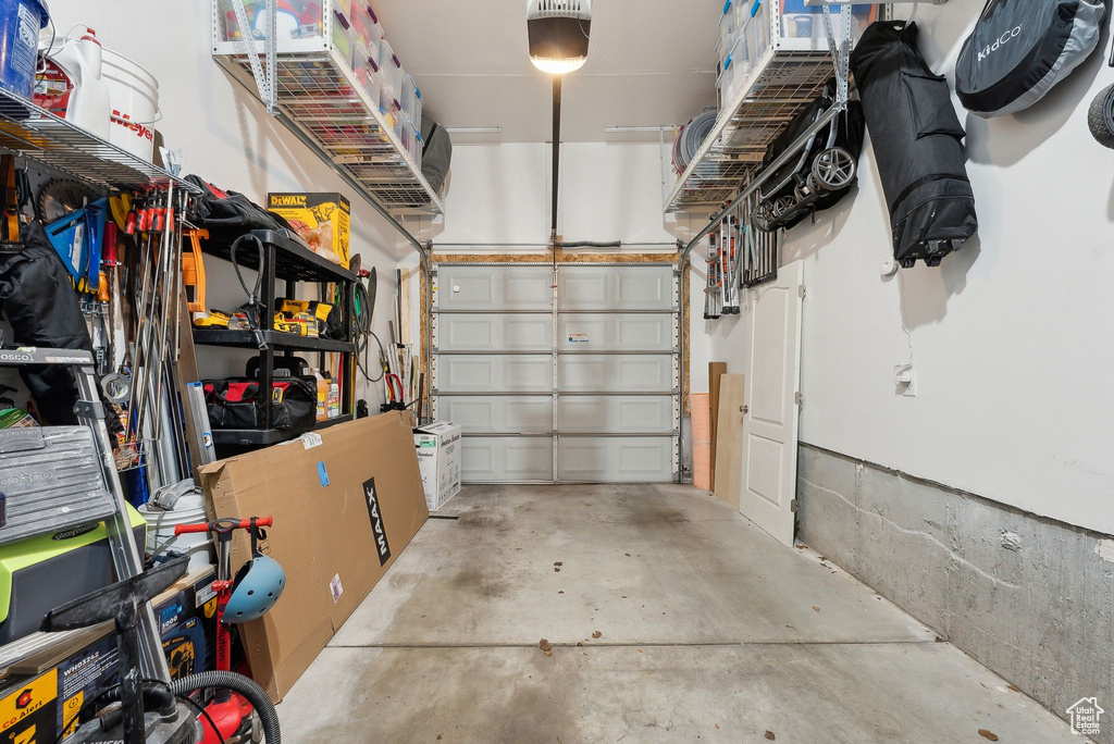 Garage featuring a garage door opener
