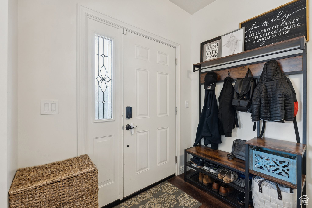 Mudroom featuring dark wood finished floors