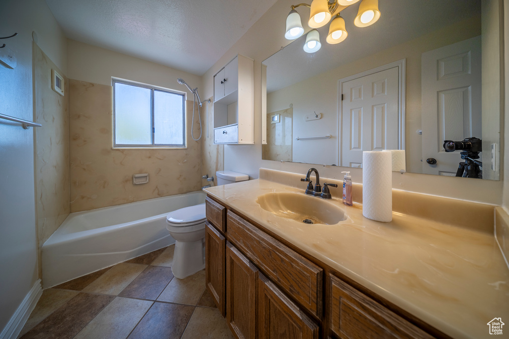 Full bathroom featuring visible vents, shower / washtub combination, vanity, toilet, and an inviting chandelier