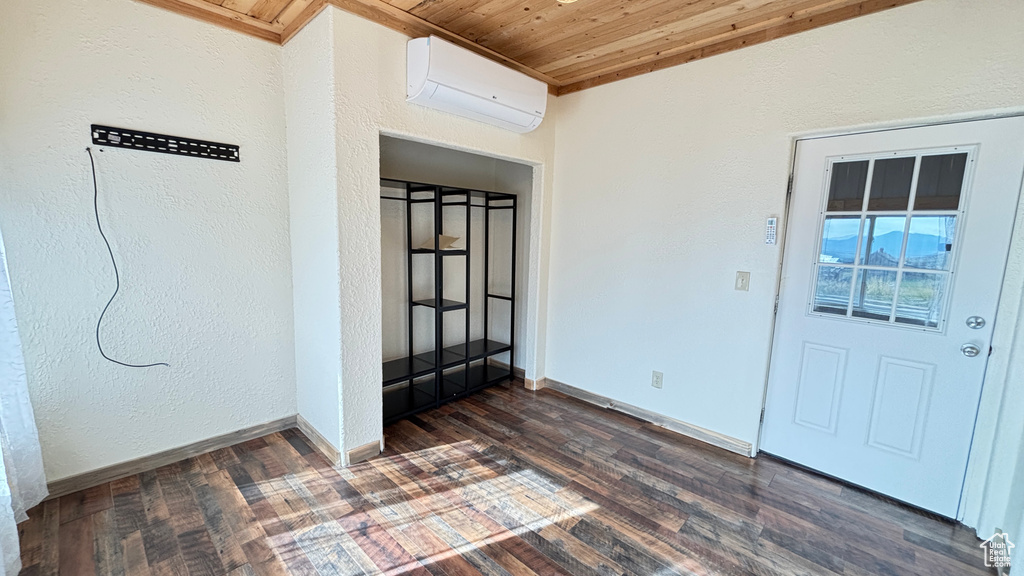 Doorway to property featuring a wall mounted AC