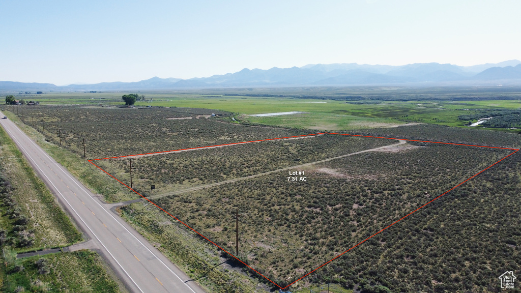 Overview of rural landscape with mountains and property boundaries highlighted