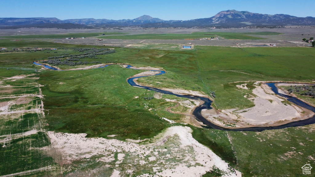 Aerial view of property and surrounding area with rural landscape and mountains