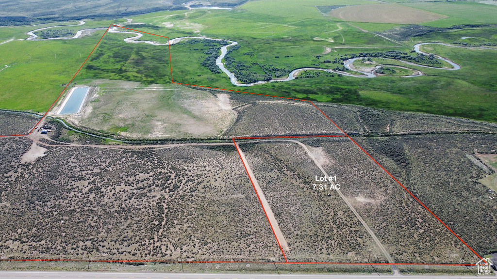 Aerial view of sparsely populated area featuring property parcel outlined