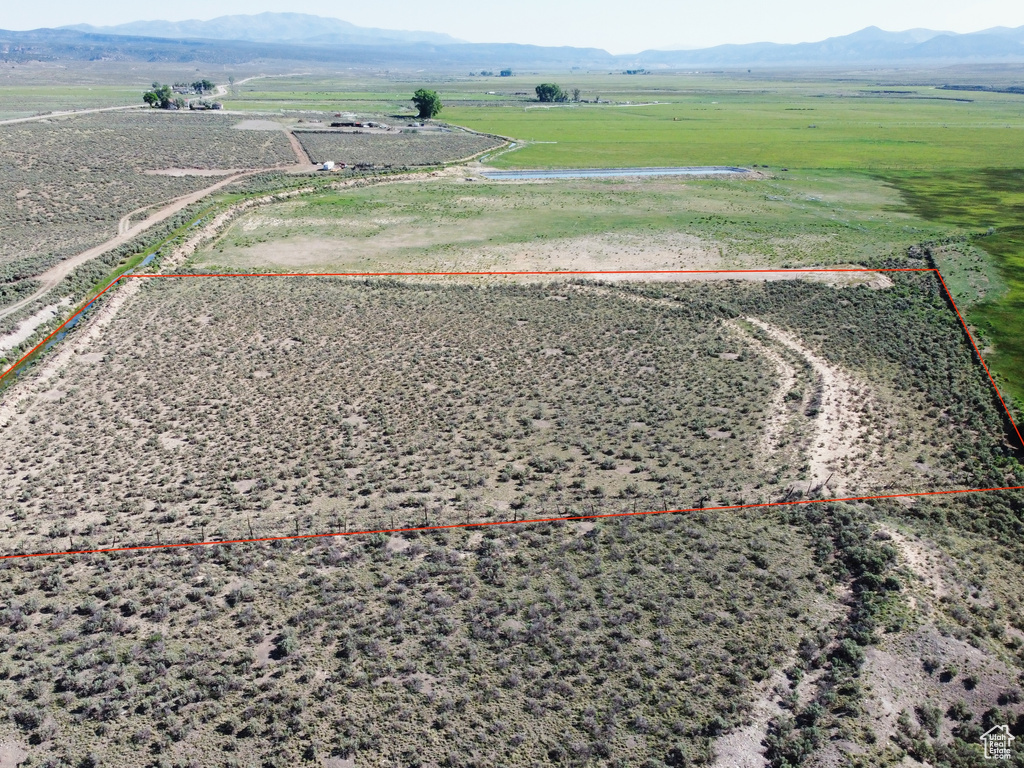 View of rural area featuring a mountainous background and property boundaries highlighted