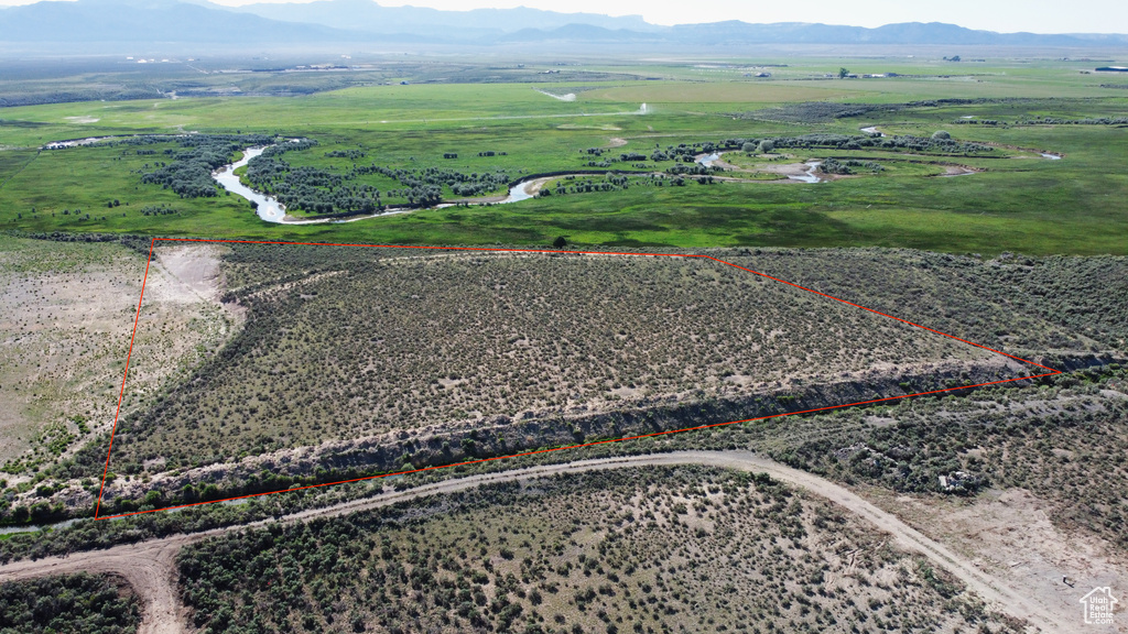 View of rural area featuring a mountainous background and property boundaries highlighted
