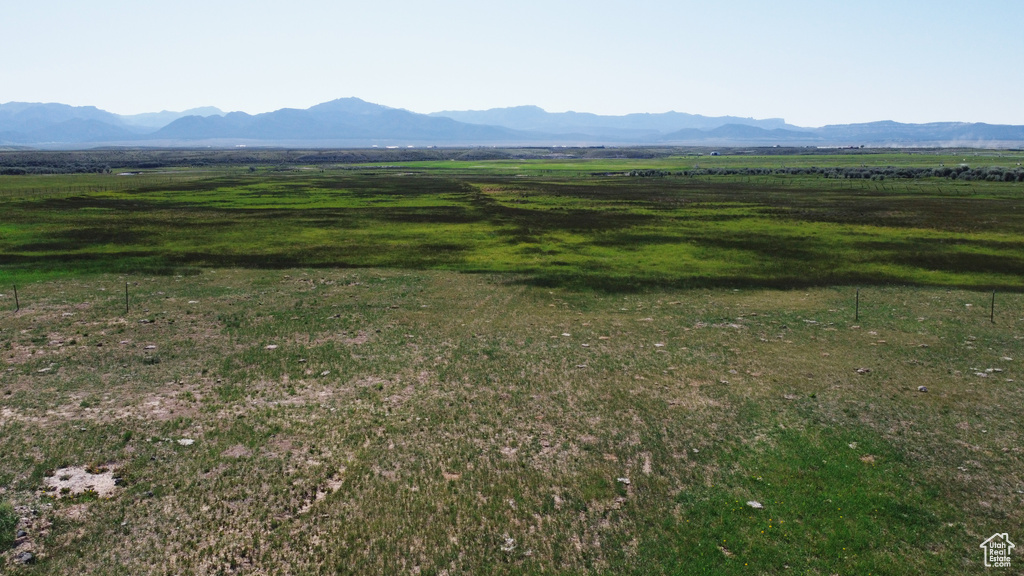 View of mountain backdrop with rural landscape