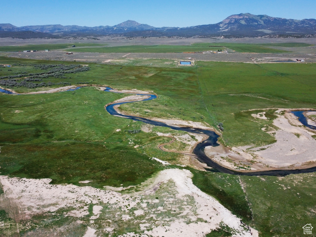 Aerial view of property and surrounding area with rural landscape and mountains