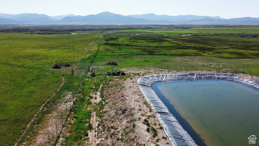 Aerial view of sparsely populated area featuring a water and mountain view