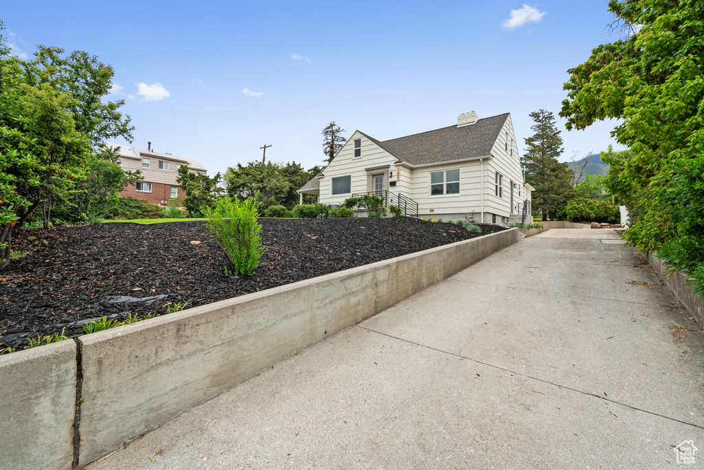View of side of property with a chimney