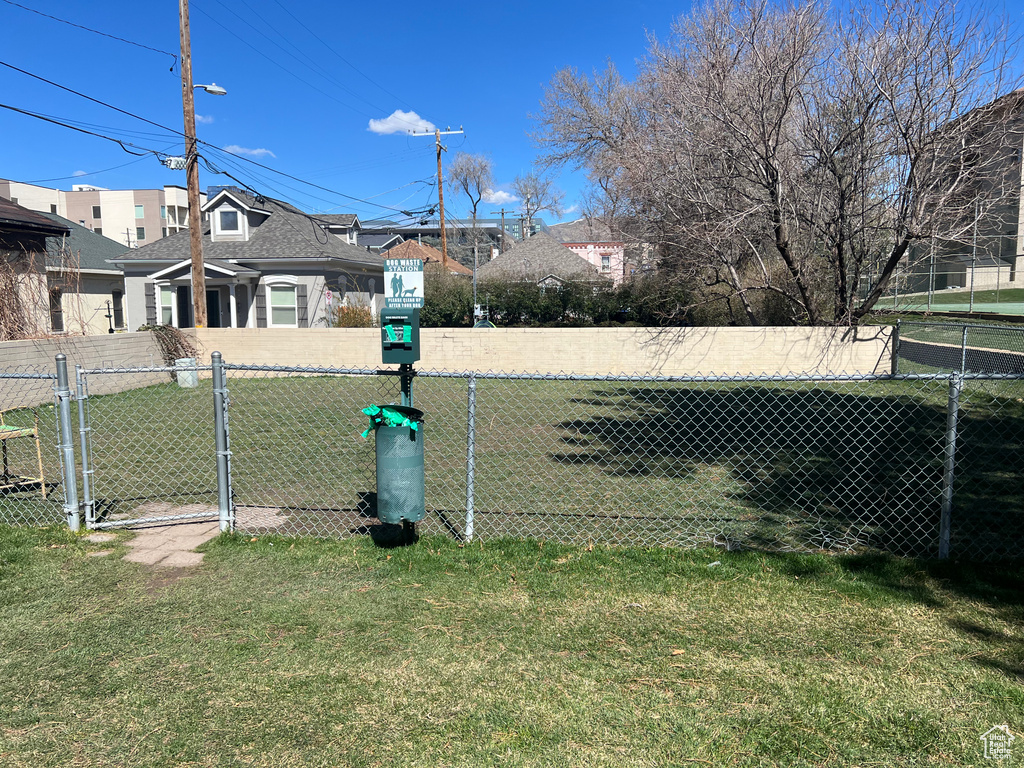 View of yard featuring a gate and fence