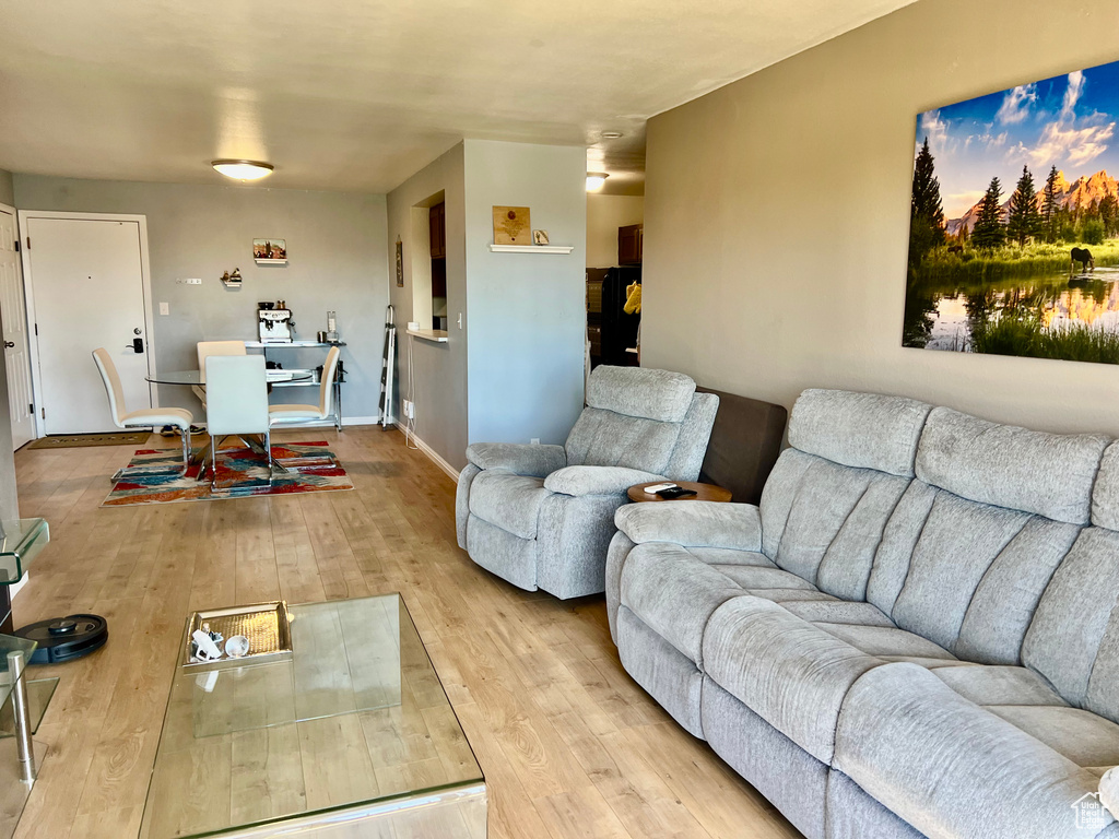 Living room with baseboards and wood finished floors