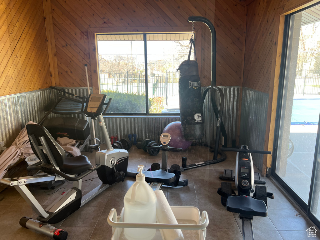 Workout area featuring wooden walls