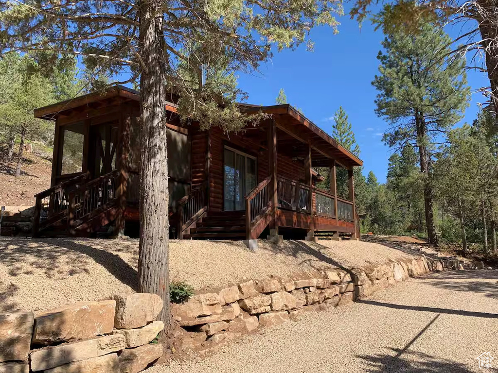 View of side of home with a porch