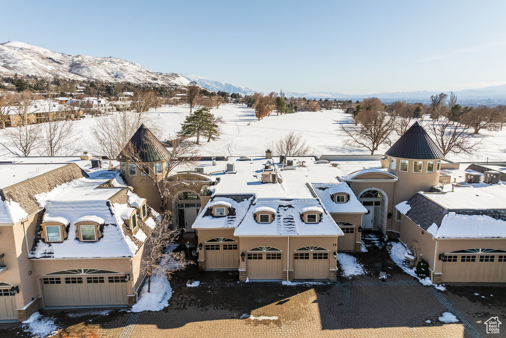 Snowy aerial view with a mountain view