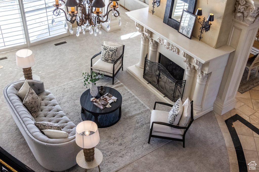 Living area featuring visible vents and a premium fireplace