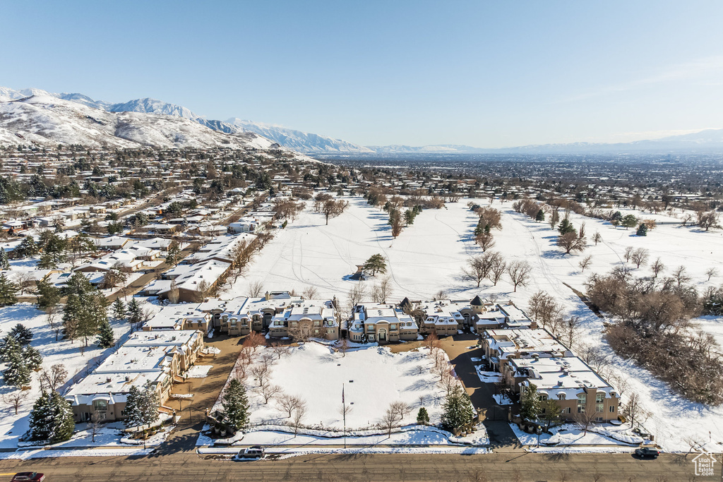 Snowy aerial view featuring a mountain view