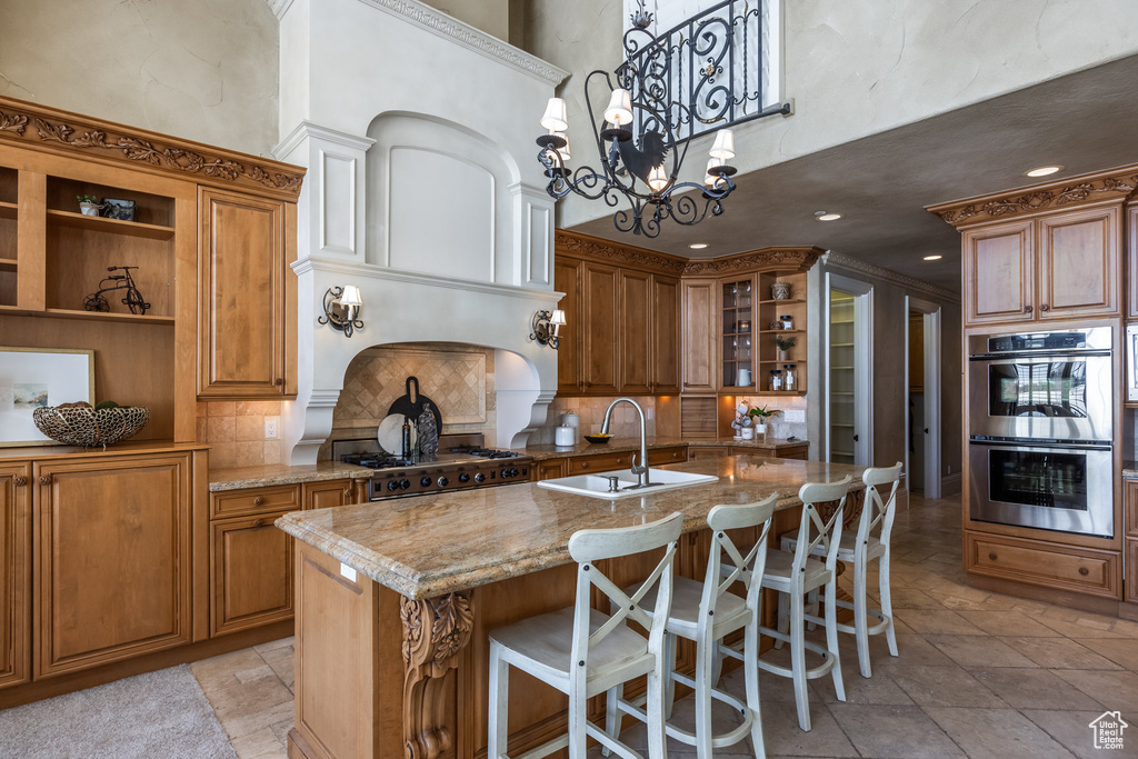 Kitchen with range, a sink, open shelves, double oven, and a high ceiling
