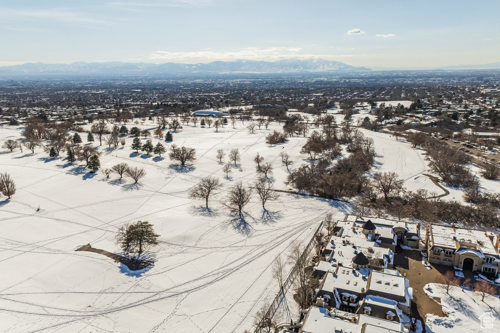 Snowy aerial view featuring a mountain view