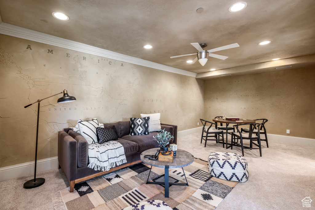 Living room featuring crown molding, carpet, baseboards, recessed lighting, and a ceiling fan
