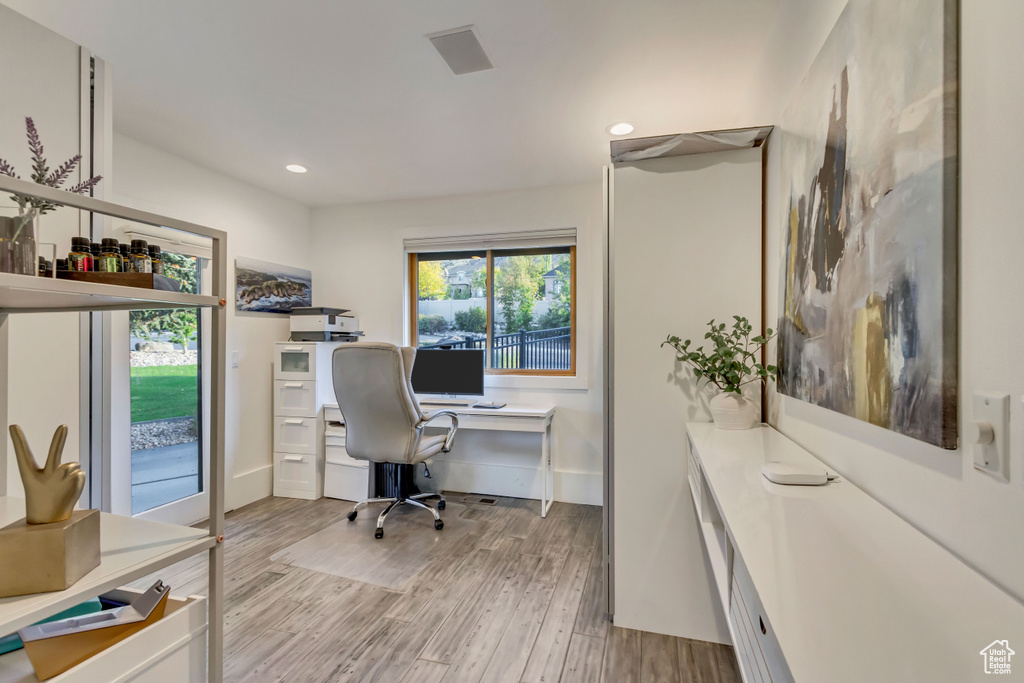 Office area featuring baseboards, recessed lighting, and light wood-type flooring