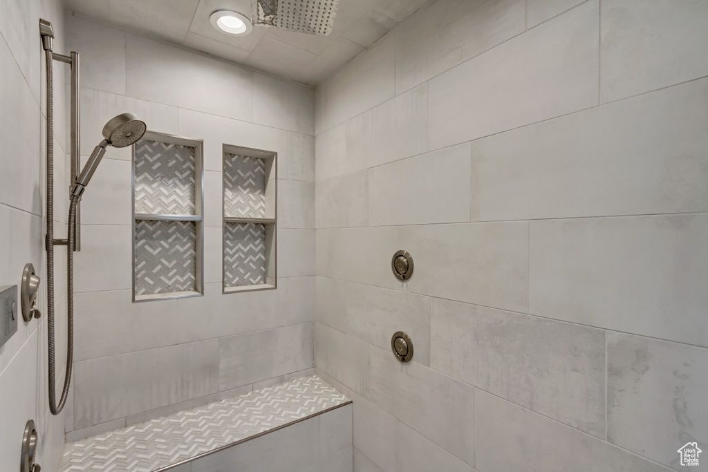 Bathroom featuring a tile shower