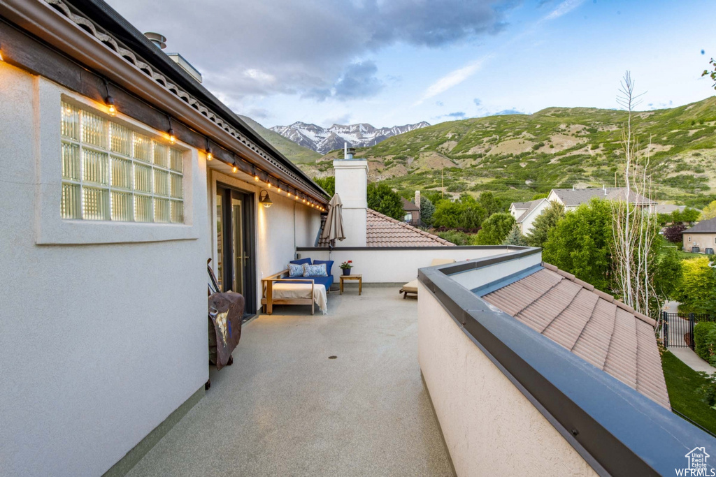 View of patio / terrace with a balcony and a mountain view