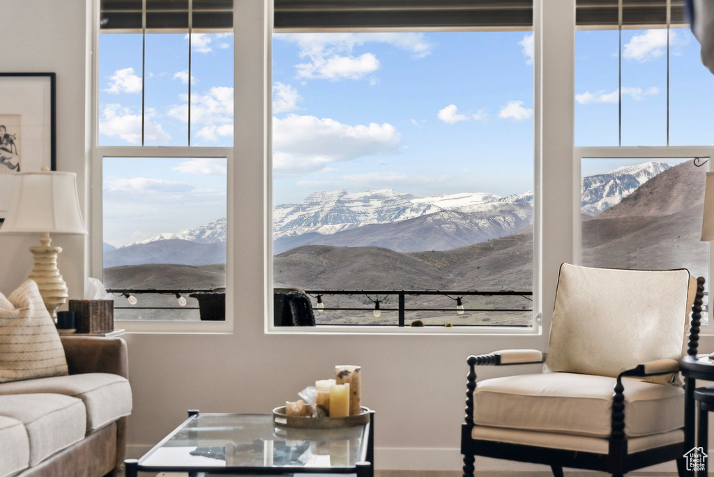 Sitting room with plenty of natural light and a mountain view