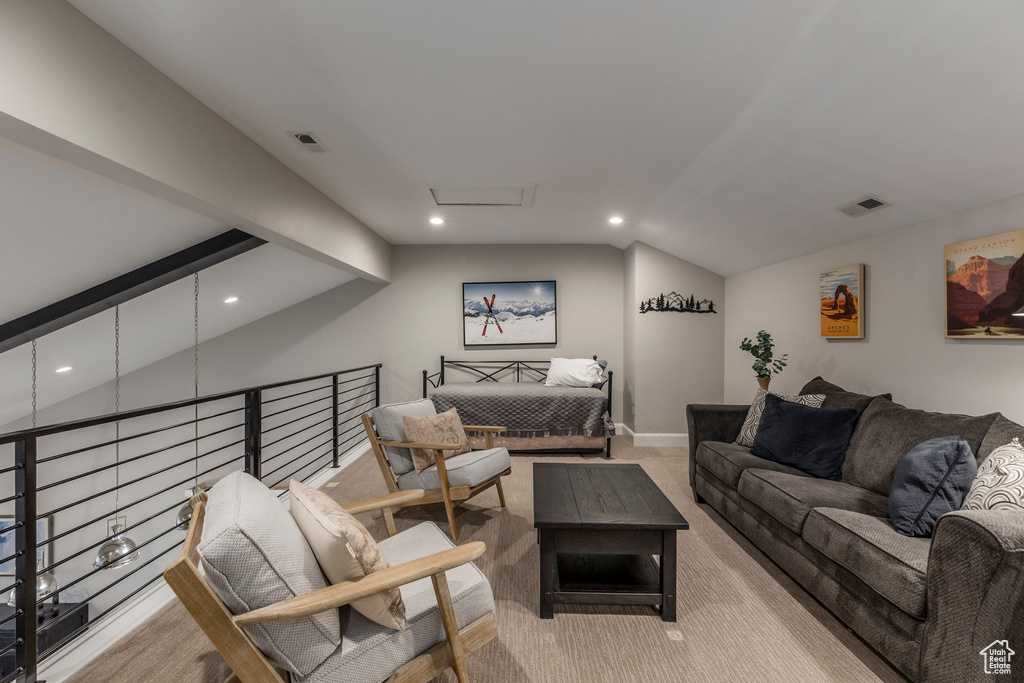 Living area with recessed lighting, carpet flooring, baseboards, and attic access