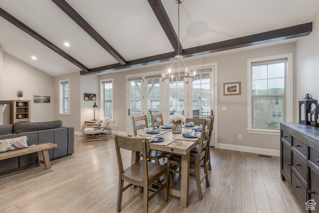 Dining area featuring a chandelier, light wood-type flooring, baseboards, and recessed lighting