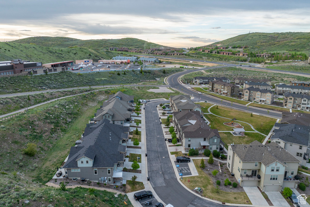 View of property location featuring mountains and nearby suburban area