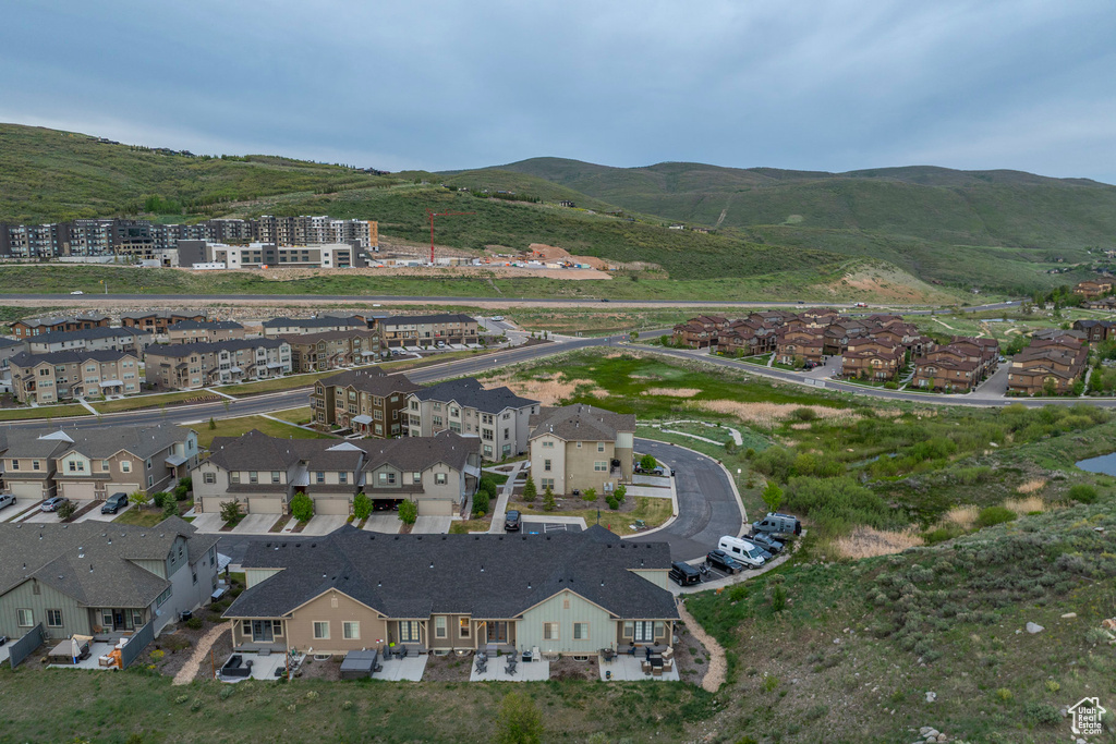 View of property location featuring a mountainous background and nearby suburban area