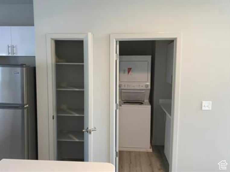 Interior space featuring stacked washer / drying machine