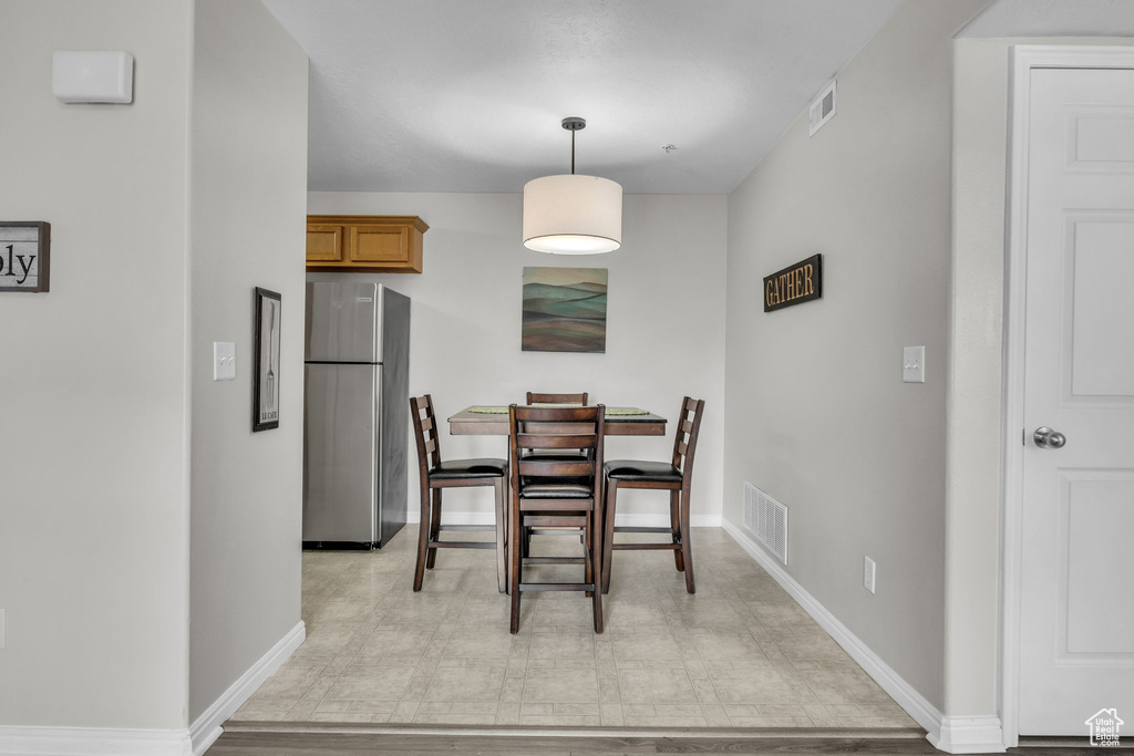 Dining space featuring baseboards and visible vents