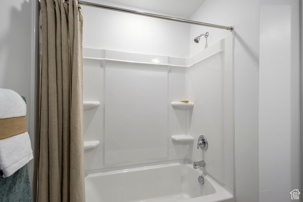 Full bathroom featuring shower / bath combination with curtain