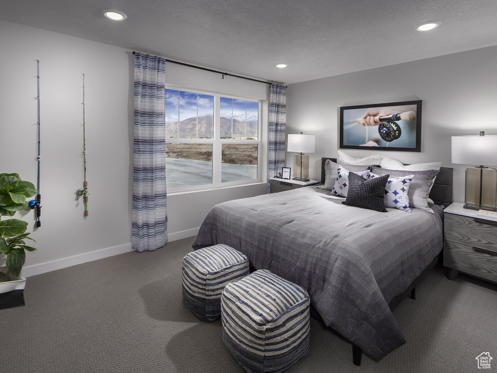 Carpeted bedroom featuring recessed lighting, baseboards, and a textured ceiling