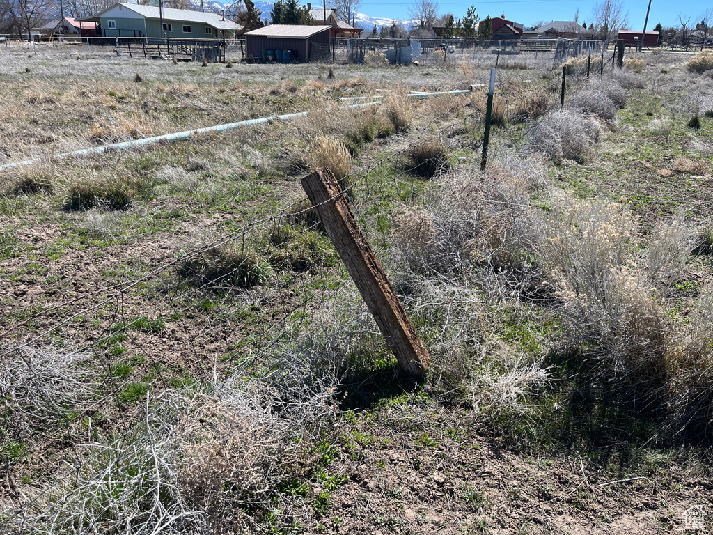 View of yard featuring fence