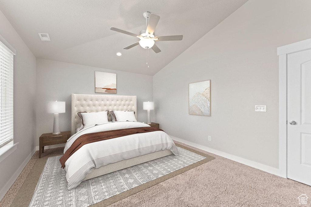 Bedroom with carpet floors, baseboards, vaulted ceiling, and visible vents