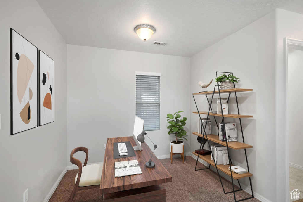 Office area featuring carpet flooring and baseboards