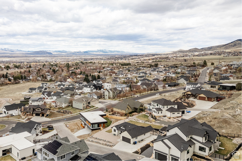 Birds eye view of property with a residential view and a mountain view