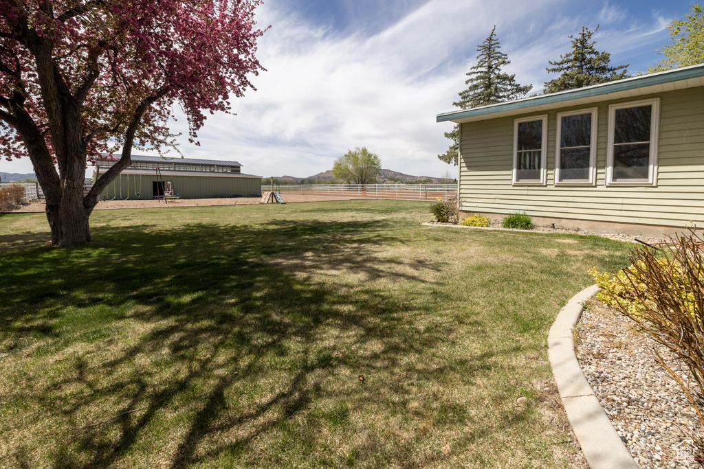 View of yard with fence