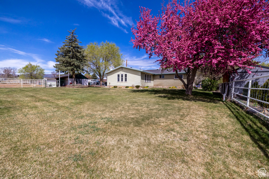 View of yard featuring fence