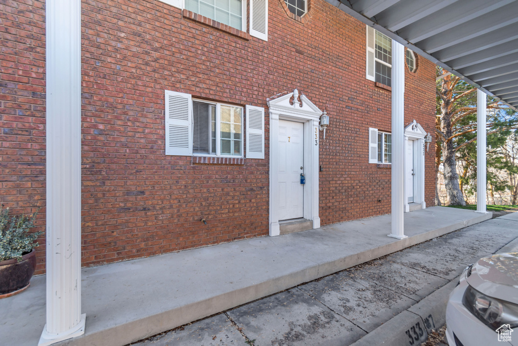 Property entrance with brick siding