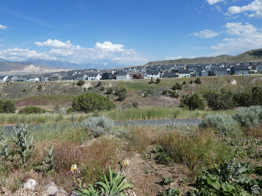 View of mountain backdrop featuring nearby suburban area