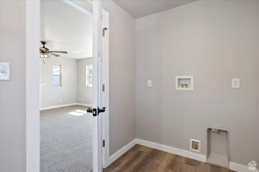 Clothes washing area with hookup for a washing machine, baseboards, dark wood-type flooring, a ceiling fan, and laundry area