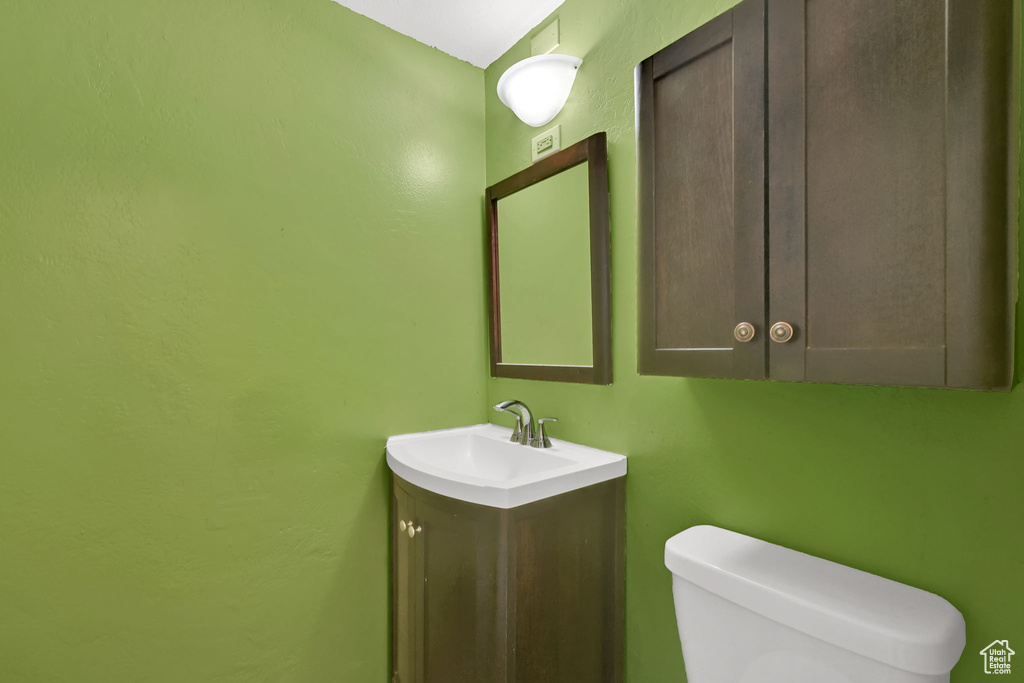 Bathroom with toilet and vanity