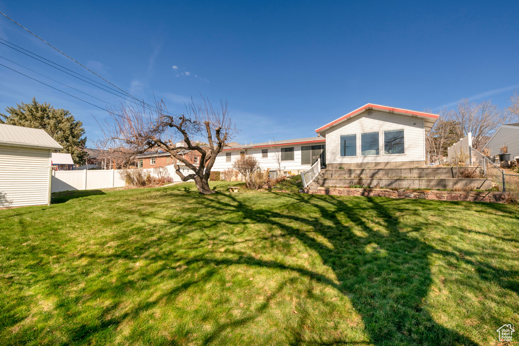 View of yard featuring fence