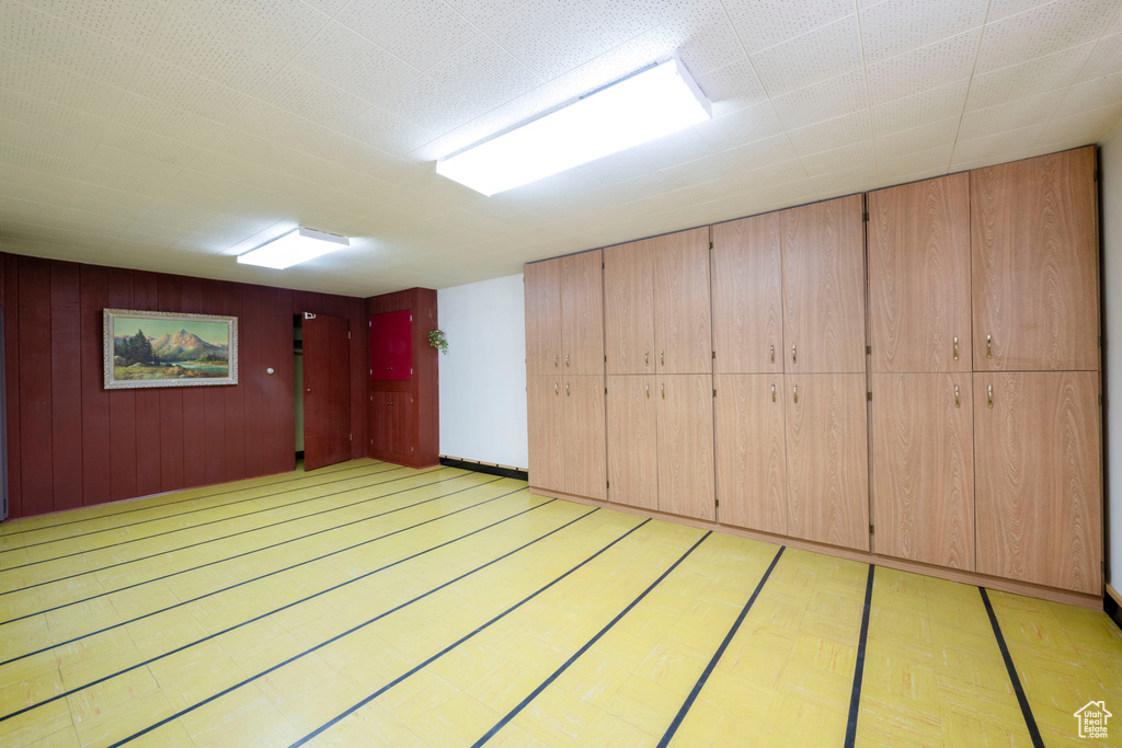 Interior space featuring light wood finished floors and wooden walls