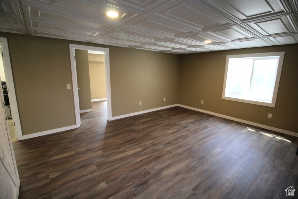 Spare room with recessed lighting, dark wood-style flooring, an ornate ceiling, and baseboards