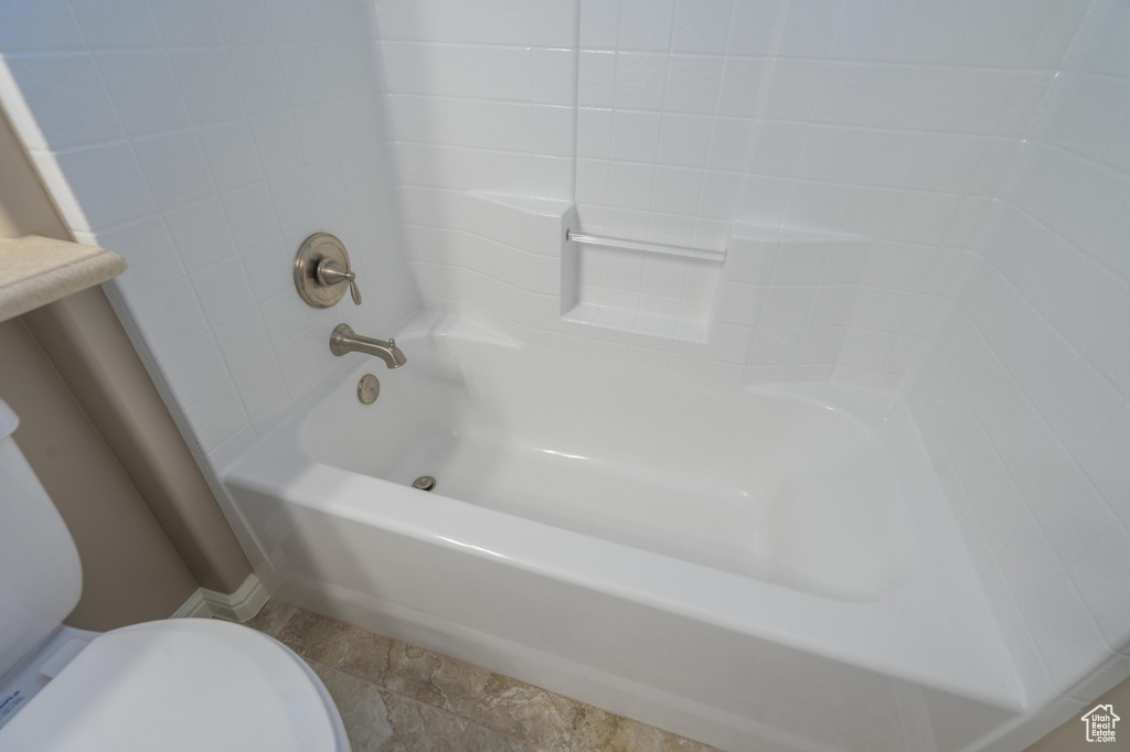 Full bath featuring shower / washtub combination and toilet