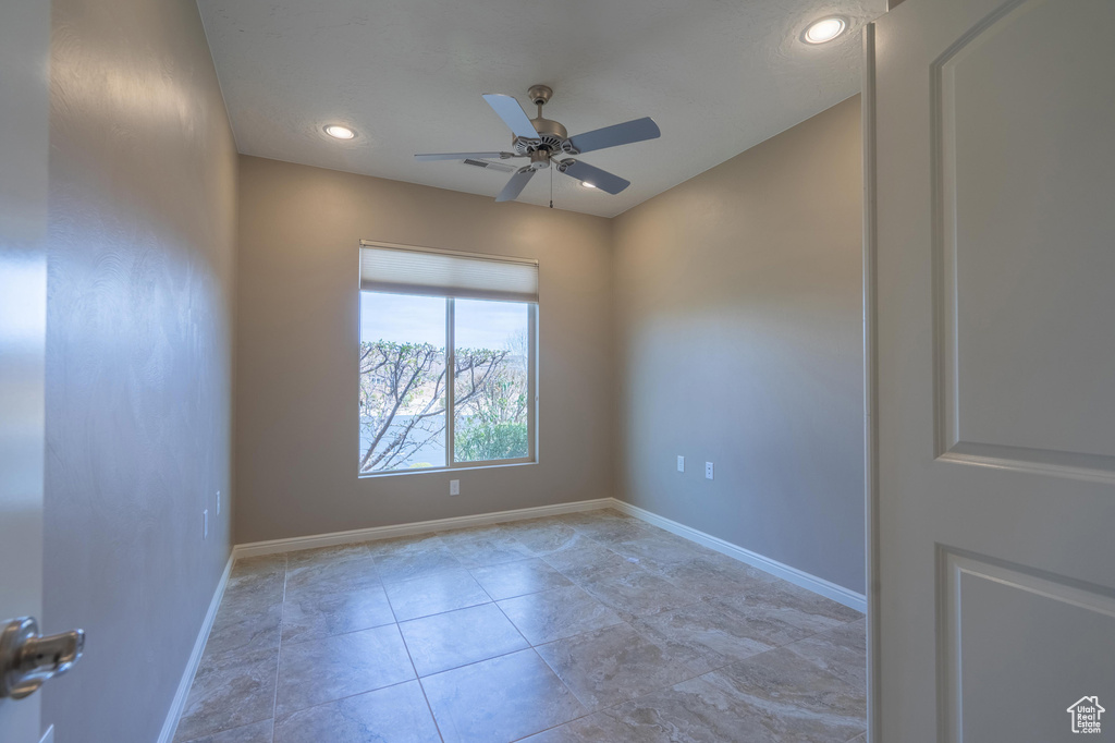 Unfurnished room featuring a ceiling fan, tile patterned floors, baseboards, and recessed lighting